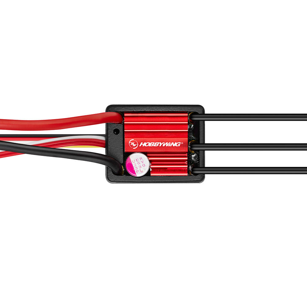 Hobbywing compact red aluminum ESC with black motor wires and servo lead, top-down view